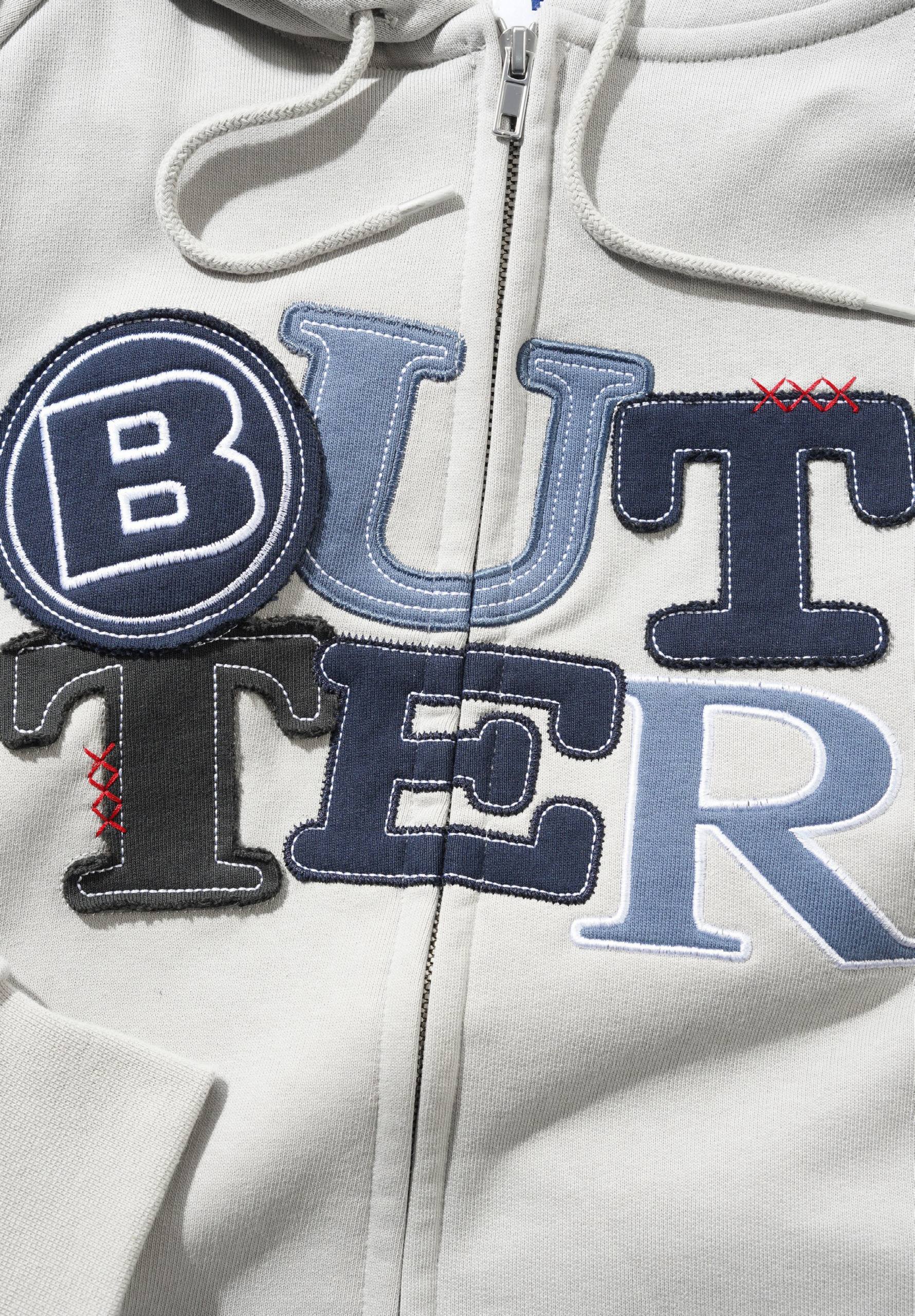 BUTTER GOODS SUDADERA DE CAPUCHA PATCHWORK ZIP THRU HOOD CEMENT DETALLE
